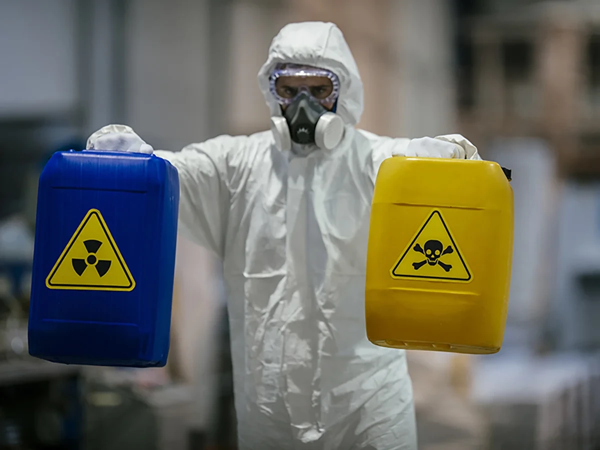 Biohazard cleanup technicians in protective equipment at a remediation scene in Belleville, IL near 62221